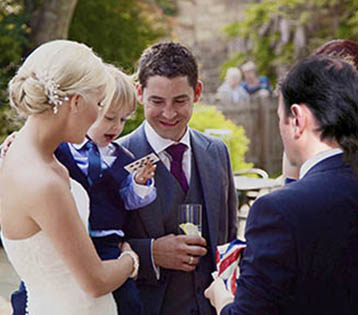 Auckland magician Vas Kovalski performs at wedding party
